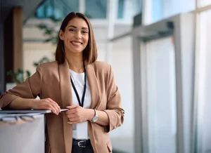 smiling-female-ceo-working-office-looking