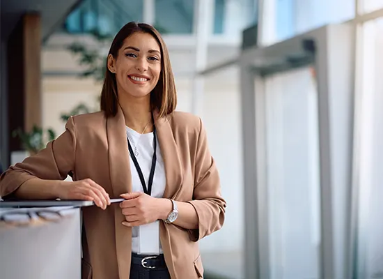 smiling-female-ceo-working-office-looking